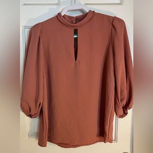 Misia brand top. Color is close to salmon. Worn once. Long sleeve. 100%poly